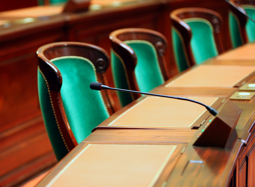 Empty,Vintage,Congress,Hall,With,Seats,And,Microphones.